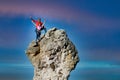 Two male and female climbers on top of a rocky peak Royalty Free Stock Photo