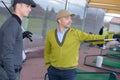 Two male golfers looking forwards Royalty Free Stock Photo