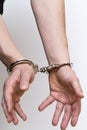 Two male hands handcuffed