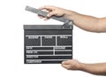 Two male hands holding movie production clapper board isolated