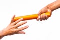 Two male hands passing a relay baton