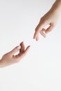 Two male hands reaching towards each other on isolated white background. Two male hands are trying to touch, like a Royalty Free Stock Photo