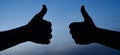 Two male hands showing thumbs up sign. Agree. Accept. Like gesture silhouette. Success. Royalty Free Stock Photo