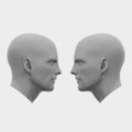 Two male heads facing each other