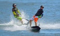 Two Male Motorsurf Competitors racing around course marker.