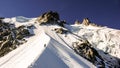 Two male mountain climbers on an exposed ridge in the French Alps near Chamonix