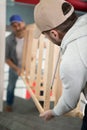 two male movers carrying empty shelf on staircase Royalty Free Stock Photo