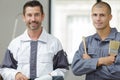 Two male painters posing indoors