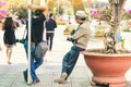 Two male photographers are waiting for customers to hire to take pictures at Dalat Flower Gardens