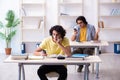 Two male students in the classroom Royalty Free Stock Photo