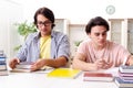 Two male students preparing for exams at home Royalty Free Stock Photo