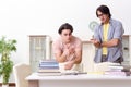 Two male students preparing for exams at home Royalty Free Stock Photo