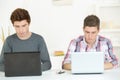 Two male students using laptops Royalty Free Stock Photo