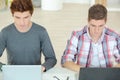 Two male students using laptops Royalty Free Stock Photo