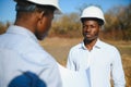 Two male surveyors working at mining site Royalty Free Stock Photo