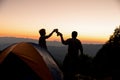 Two male tourists are happy at the top of the mountain. Royalty Free Stock Photo