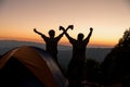 Two male tourists are happy at the top of the mountain. Royalty Free Stock Photo