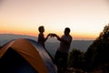 Two male tourists are happy at the top of the mountain. Royalty Free Stock Photo