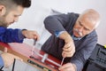 Two male workers carpenters at internal door installation