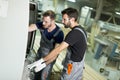 Two male workers working in furniture industry