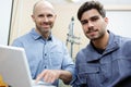Two male workers in workshop Royalty Free Stock Photo