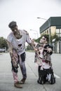 Two male zombies standing in empty city street