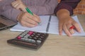 Two man accountants counting on calculator income for tax form completion hands closeup. Internal Revenue Service inspector checki