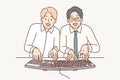 Two man computer geeks use keyboard to type code at same time to develop programs or applications Royalty Free Stock Photo