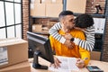 Two man ecommerce business workers kissing and working at office