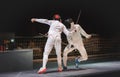 Two man fencing athlete fight on professional sports arena