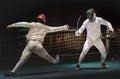 Two man fencing athlete fight on professional sports arena