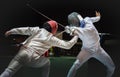 Two man fencing athlete fight on professional sports arena Royalty Free Stock Photo