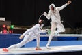 Two man fencing athletes fight