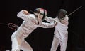 Two man fencing athletes fight