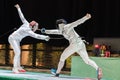 Two man fencing athletes fight