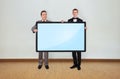Two man holding plasma Royalty Free Stock Photo