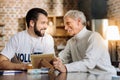 Two man laughing while looking at the photo Royalty Free Stock Photo