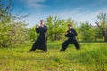 Two man practice tai Chi in qigong a apple garden Royalty Free Stock Photo