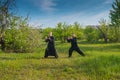 Two man practice tai Chi in a savage garden Royalty Free Stock Photo