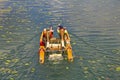 Two man ride with floating pedal bicycle boat Royalty Free Stock Photo