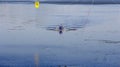 Two man in a sports boat rowing on the lake