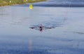 Two man in a sports boat rowing on the lake