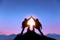 Two man with success gesture on the mountain