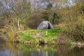 A two man tent pitched on a piece of ground beside the lake at the old lead mines workings in Conlig, County Down in N Ireland Royalty Free Stock Photo