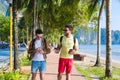 Two Man Using Cell Smart Phones Tropical Park Couple Chatting Online Holiday Sea Summer Vacation Royalty Free Stock Photo