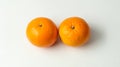 two mandarin oranges on a white background Royalty Free Stock Photo