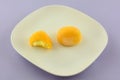 Mango ice cream mochi with missing bite Royalty Free Stock Photo