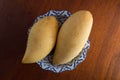 Two mangoes on a plate Royalty Free Stock Photo