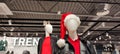 Two mannequins in a clothing store at Christmas, decorated mannequins for new year. A mannequin in a Christmas New Year Royalty Free Stock Photo