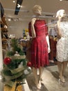 Two mannequins with latest dress model and a mini christmas tree decoration
